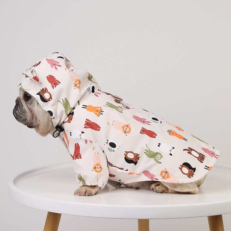 RainShield Dog Jacket for small to medium dogs, waterproof, lightweight, features playful animal prints, perfect for rainy days.