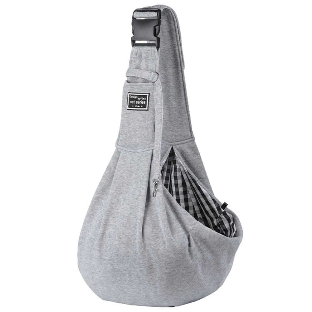 Adjustable Dog Sling Carrier, gray fabric, comfortable interior for small dogs, perfect for on-the-go pet owners.