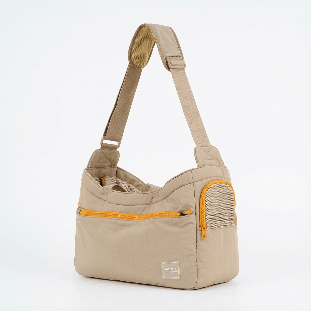 BreezeVent Pet Travel Bag, all-season carrier with breathable mesh panels for dogs and cats, convenient crossbody design.