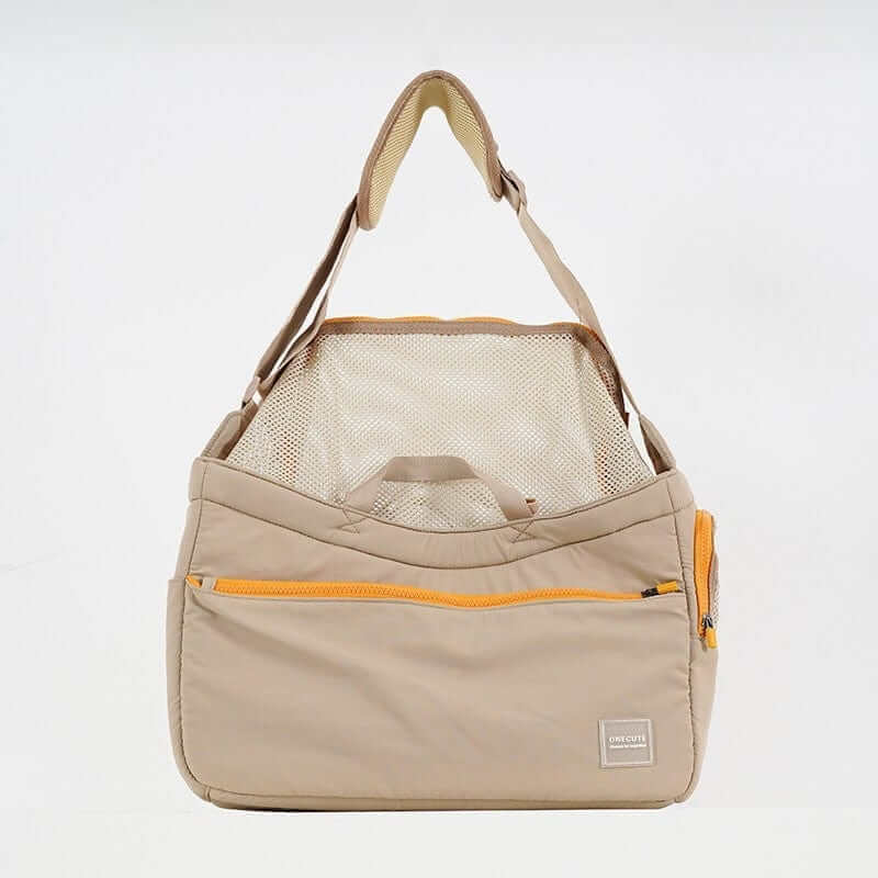 BreezeVent Pet Travel Bag, all-season carrier with breathable mesh, hands-free design for dogs and cats.