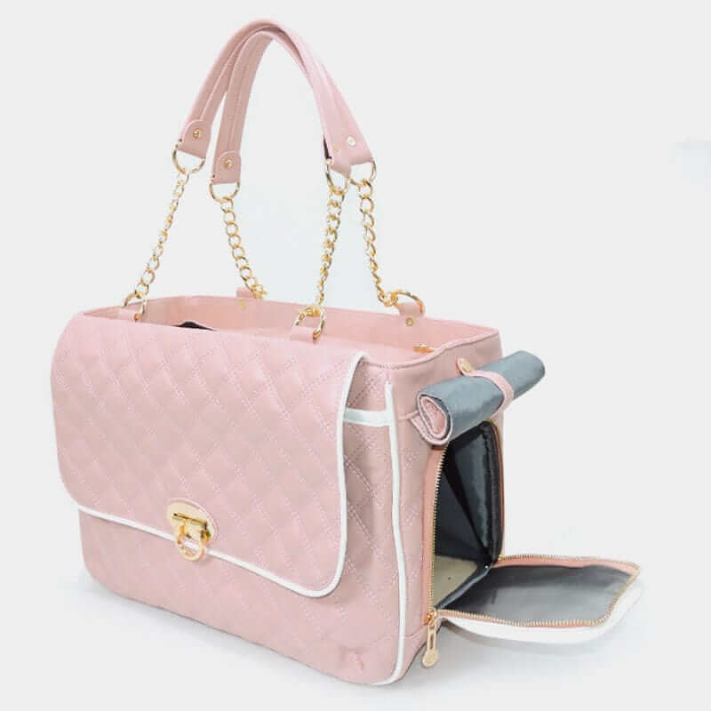 Chic Leather Pet Carrier for dogs and cats, pink luxury design, featuring breathable material and stylish hardware.