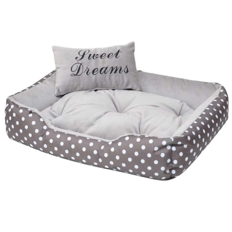 ComfortNest Dog Bed with plush padding and decorative pillow featuring 'Sweet Dreams' in gray and white, ideal for dogs.