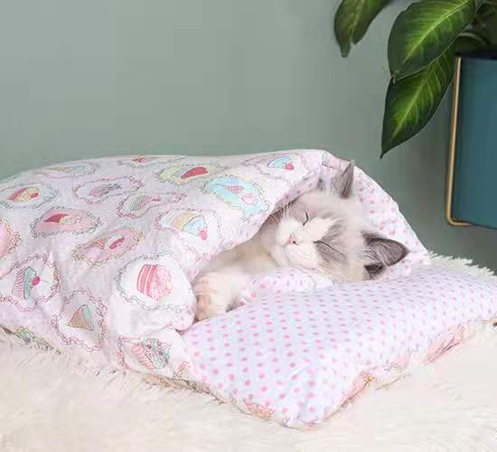 CozyNest Washable Cat Bed with soft material and detachable design, providing warmth and security for cats.