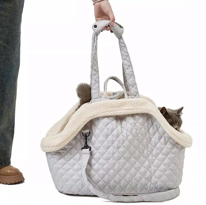 Elegant Quilted Pet Carrier for stylish travel with a cat, featuring a chic quilted design and plush interior.