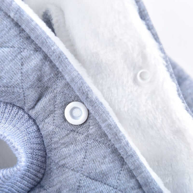 Close-up of the soft fabric and snap button detail on the Grr And Purr Two-legged Dog Sweater for ultimate comfort.