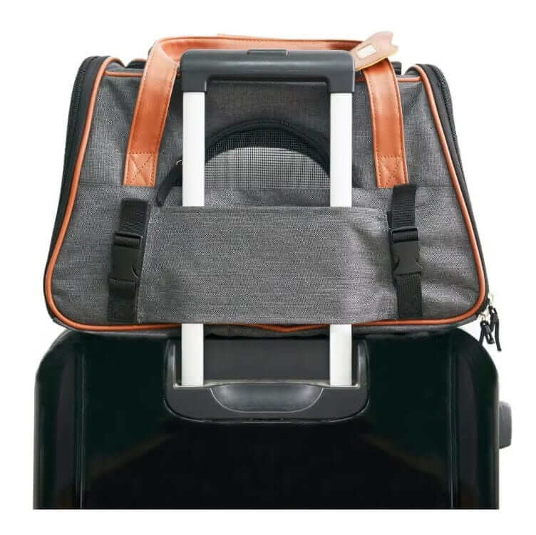 JetSet Paws Luxury Travel Pet Carrier & Car Seat on luggage, stylish pet carrier for dogs & cats with functionality.