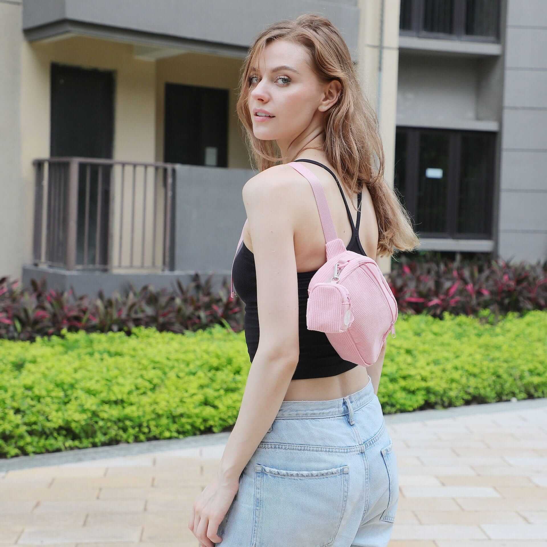 The Luxe Corduroy Dog Collection walking bag on model in urban setting, stylish and functional for dog owners.