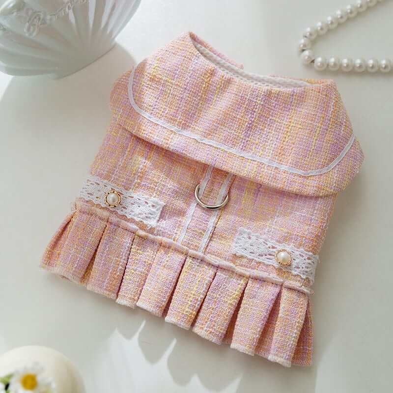 Luxury Designer Dog Dress featuring a chic pink fabric with pleats and decorative buttons, perfect for stylish small dogs.