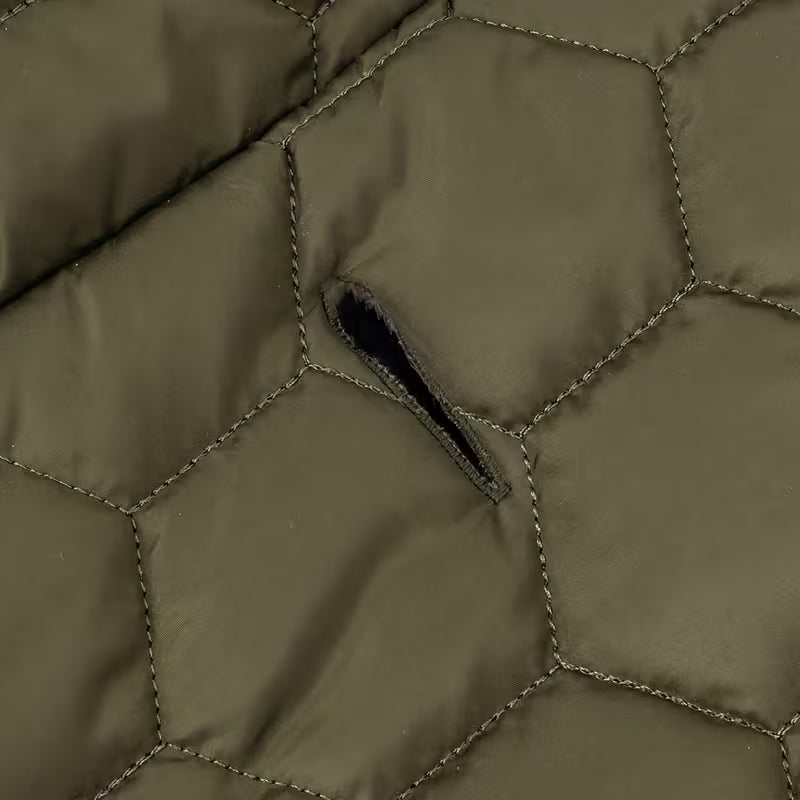 Luxury Greyhound Winter Dog Coat fabric close-up showcasing premium hexagonal stitching for warmth and style.
