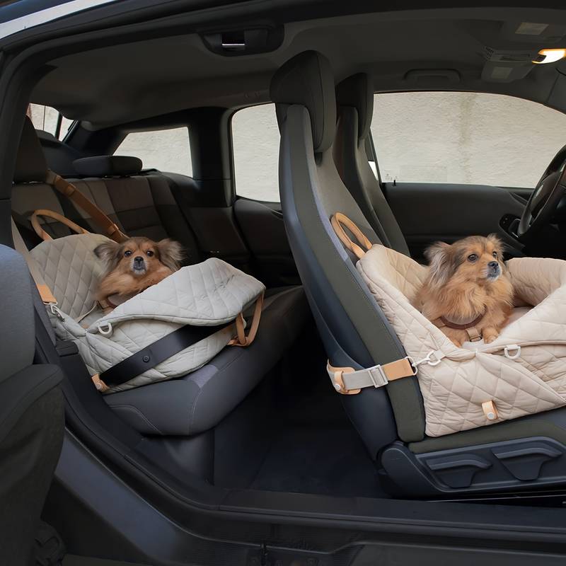 Multifunctional Pet Travel Bag with two dogs secured in car seats, showcasing waterproof and comfortable design.