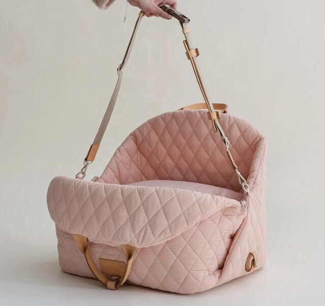 Multifunctional Pet Travel Bag showcasing a pink quilted pet carrier with adjustable strap for dogs and cats.