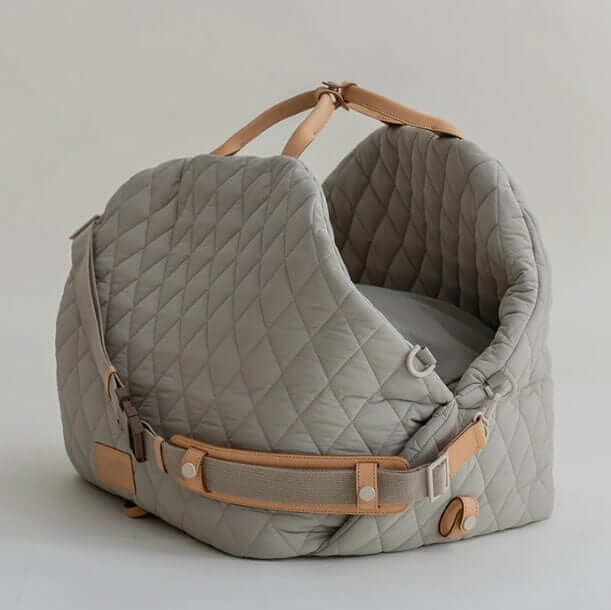 Multifunctional Pet Travel Bag designed for dogs and cats with quilted waterproof material and safety harness.