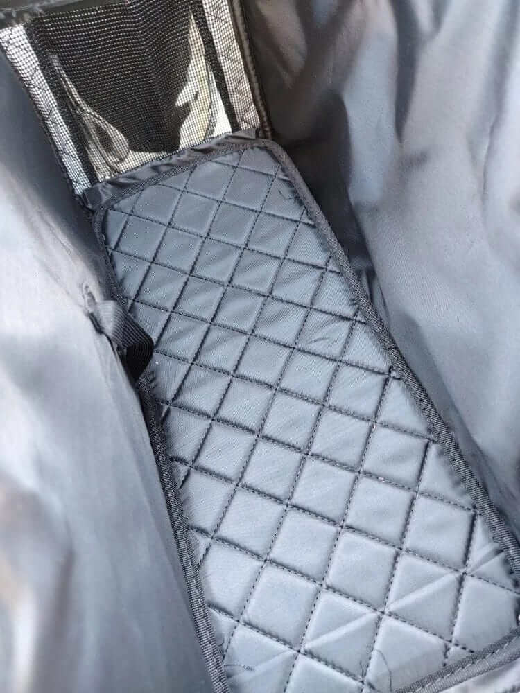 Inside view of the Sleek Leather Pet Carrier featuring a soft padded base for comfort for dogs and cats.