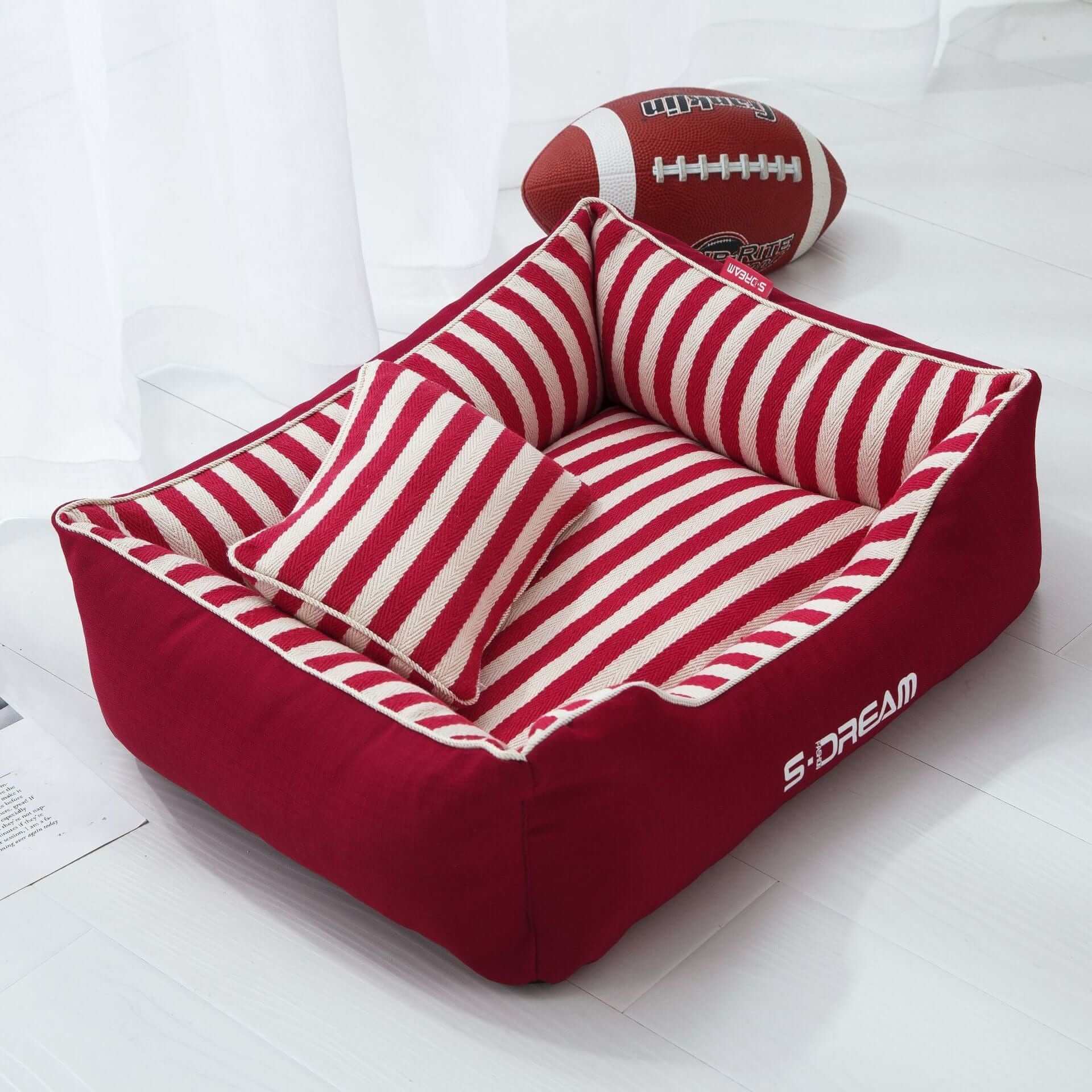 The Royal Haven Pet Bed, luxury dog and cat bed, plush soft striped design with cozy pillow, perfect for all seasons.