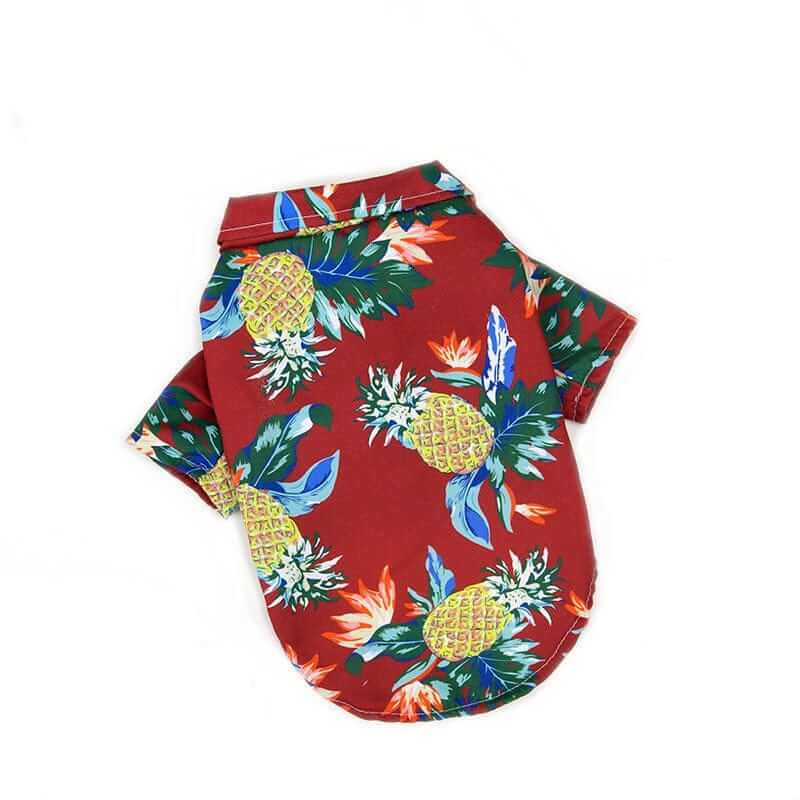 Tropical Hawaiian Pet Shirt for dogs and cats with pineapples and tropical leaves, perfect for warm weather parties.
