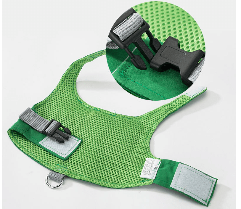 Green Dino Puppy Harness Set close-up of adjustable harness features and quick-release clasp on a green vest-style design.