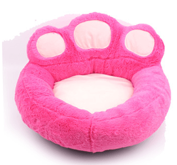 Soft Paw Pet Bed in pink plush faux fur with paw-shaped design, ideal for dogs & cats, featuring soft suede bolsters.