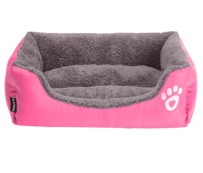 Super Soft Warm Pet Bed in pink and gray for Dogs & Cats, featuring ultra-soft fabric and nest-like walls for comfort.