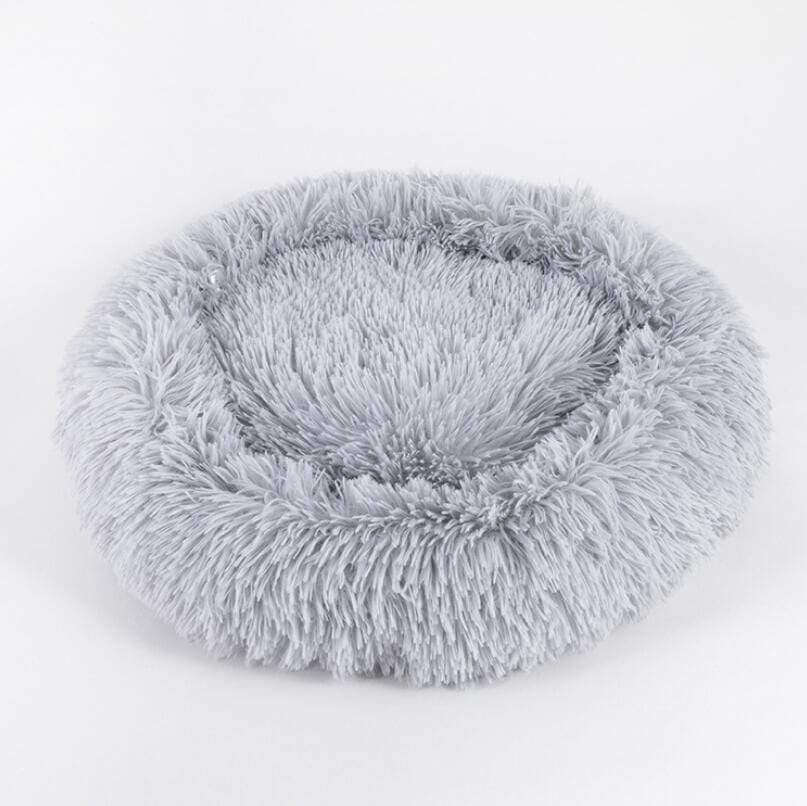 Ultra Soft Pet Bed - Round fluffy bed for dogs and cats, made of plush fur for ultimate comfort and warmth.
