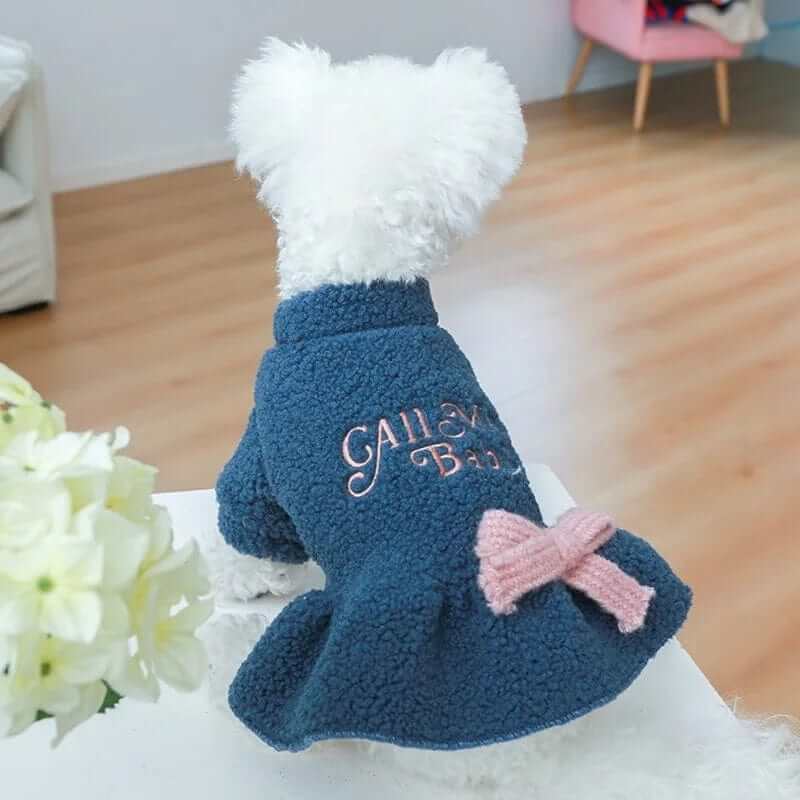 Royal Frost Bow Dress for dogs, cozy plush outfit with pink bow detail, perfect for autumn and winter seasons.