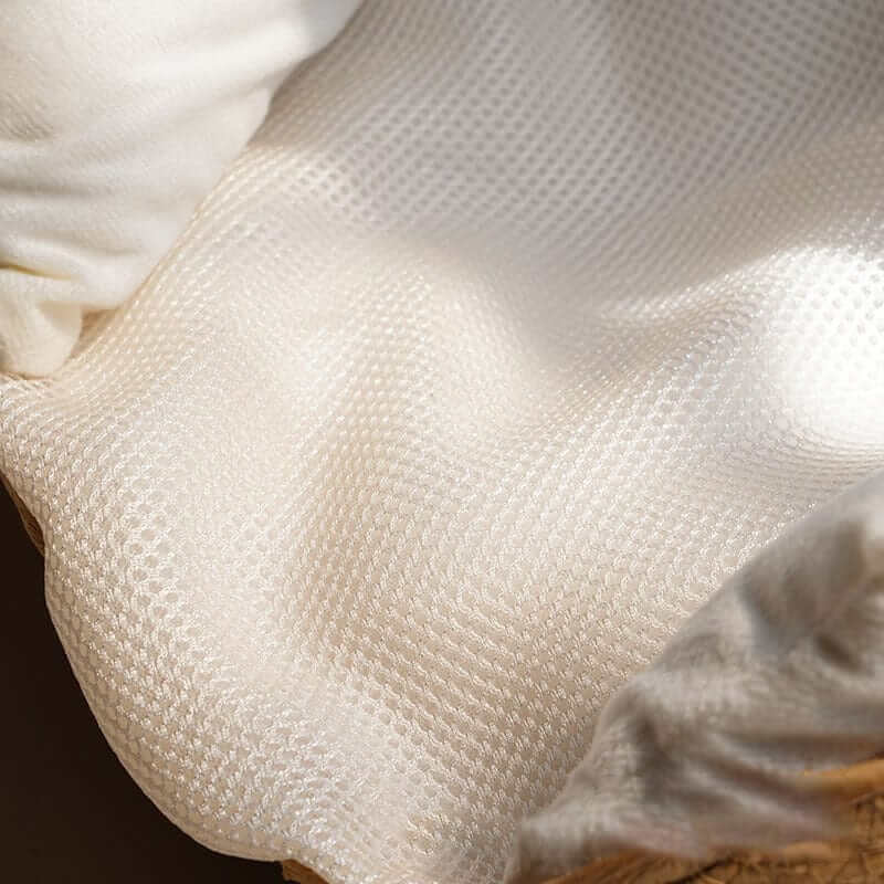 Close-up of the breathable, removable cushion in the Bamboo Pet Nest for dogs and cats.