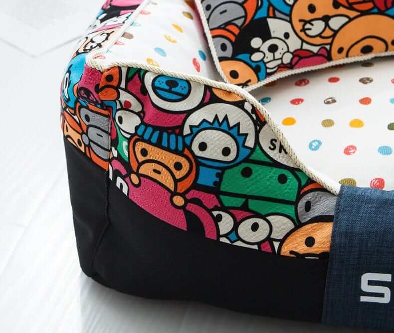Cartoon Print Luxury Pet Bed showing colorful cartoon prints and plush fabric, perfect for dogs and cats.
