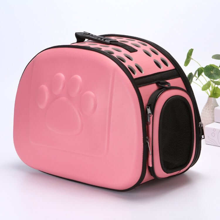 Compact Travel Pet Carrier in pink, designed for small dogs and cats with ventilation and comfort features.