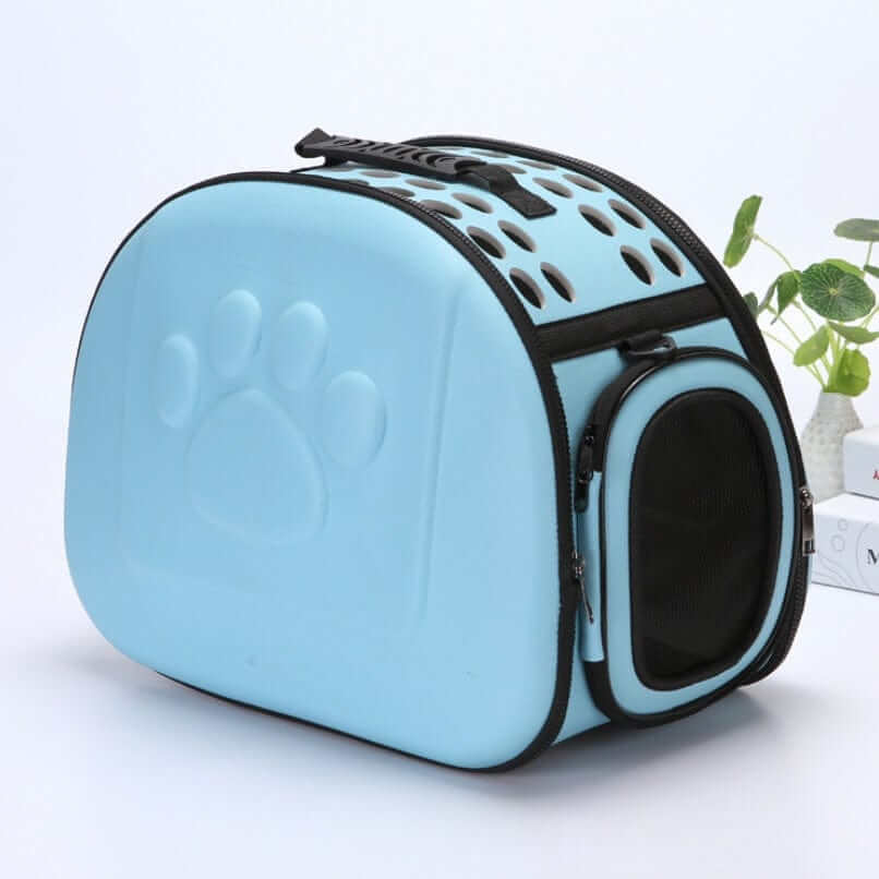 Compact Travel Pet Carrier in blue, stylish design for small dogs and cats, portable and foldable for easy travel.