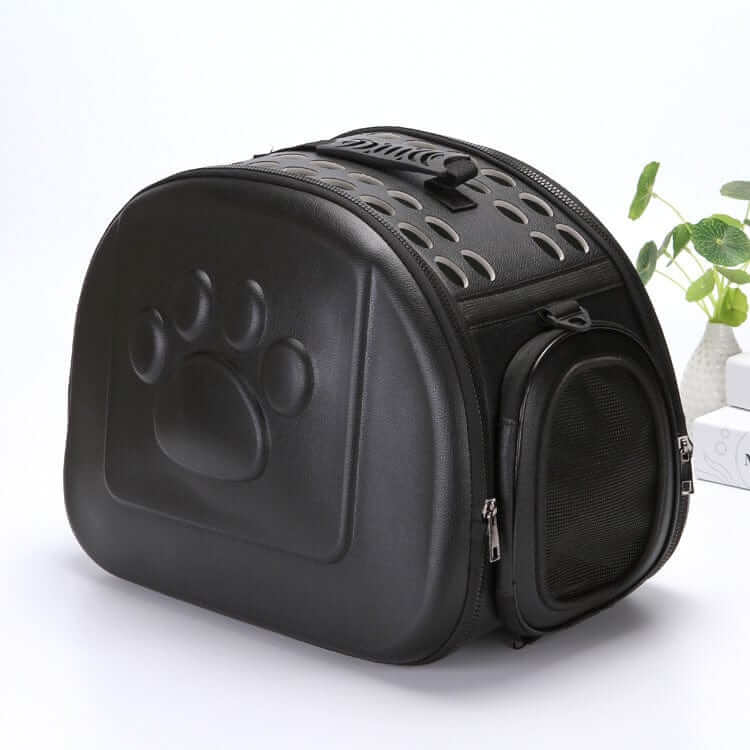 Compact Travel Pet Carrier in black, foldable design with mesh and paw print, perfect for dogs and cats.