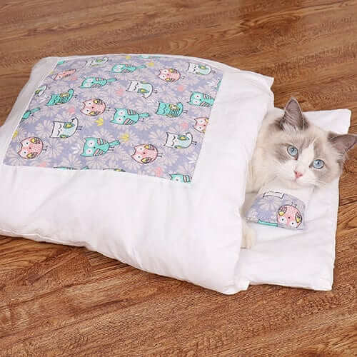 CozyNest Washable Cat Bed with cute pattern, providing warmth and comfort for cats in a cozy environment.