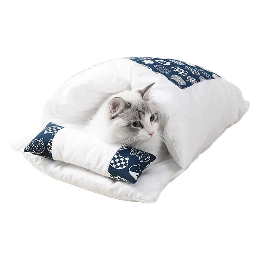 CozyNest Washable Cat Bed features a cat snuggled in a plush, semi-enclosed sleeping bag by Dogs & Cats.