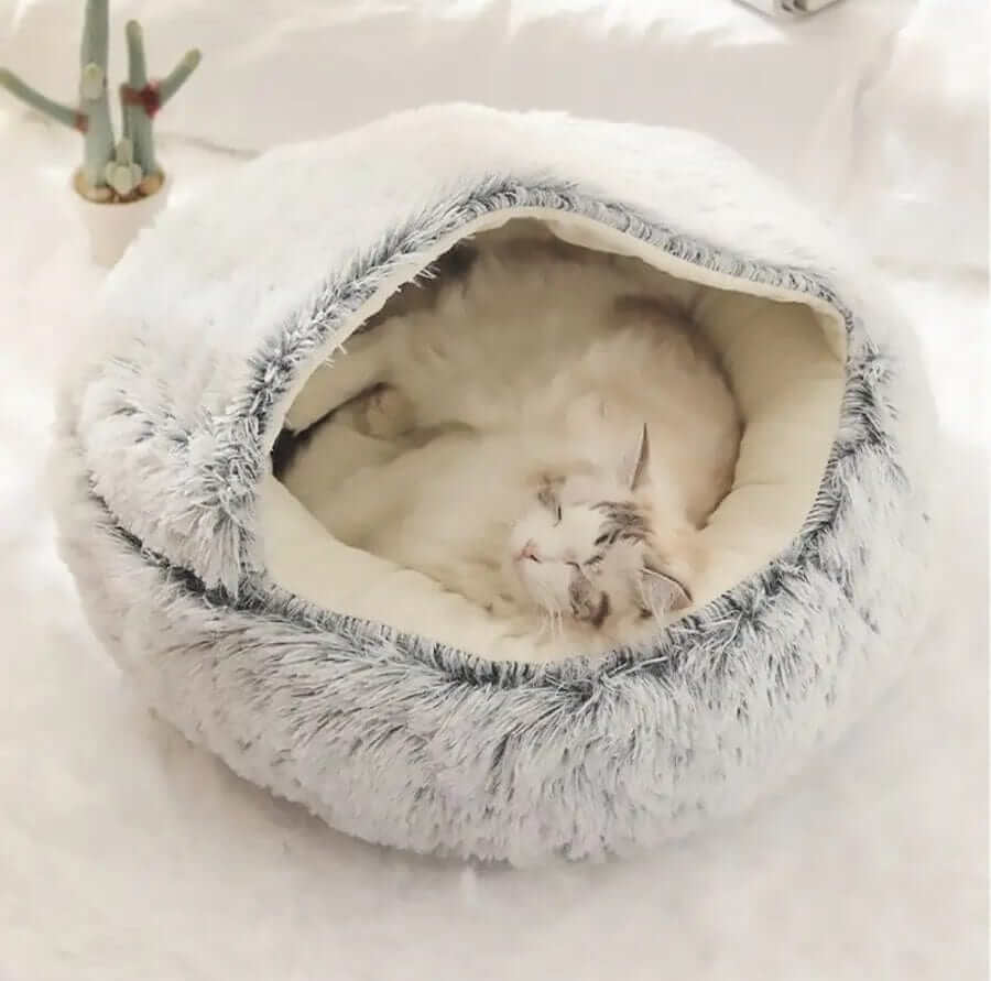 SnuggleNest Plush Cave Cat Bed with cozy plush interior, perfect for cats and small dogs, offering a warm hideaway.