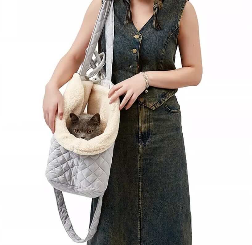 Elegant Quilted Pet Carrier in use by a woman, soft plush interior, stylish design for small dogs and cats.