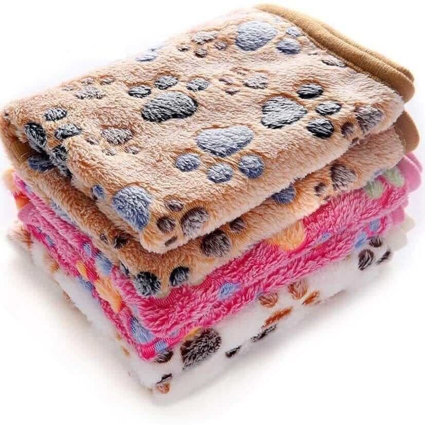 Fluffy Pet Blanket soft and fluffy blankets for dogs and cats featuring cute cartoon patterns in various colors.