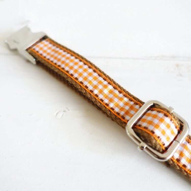 Heritage Plaid Dog Collar with refined brown check pattern and durable buckle for dogs and cats.