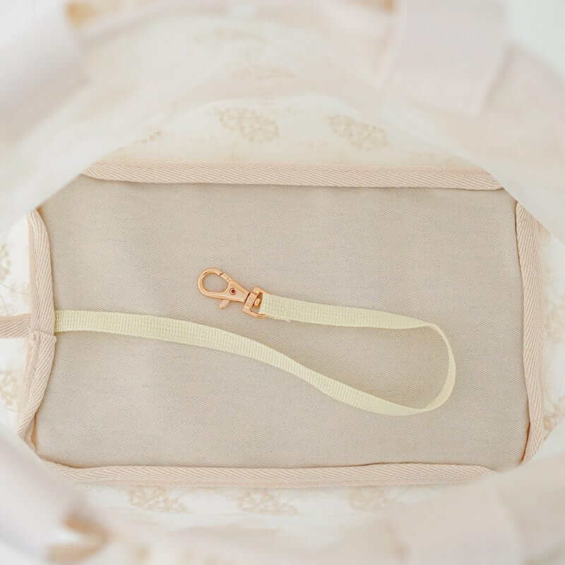 Interior view of Lace Pet Shoulder Bag featuring a safety clip and soft lining for comfort - perfect for dogs and cats.