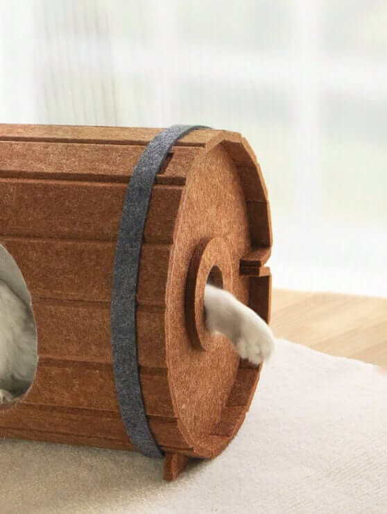 Multifunctional Wine Barrel Cat Bed & Scratcher House with a cat's paw peeking out, perfect for comfort and play.