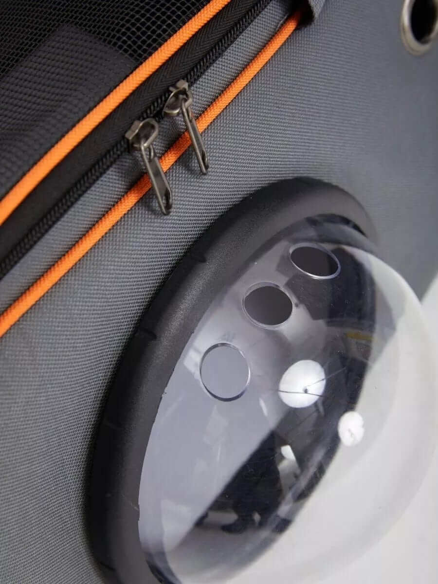 Close-up of the Pet Space Capsule Backpack showing the semi-sphere window and zipper details.