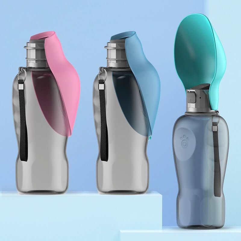 Three Portable Dog Water Bottles in pink and blue colors, designed for easy hydration on the go for dogs and cats.