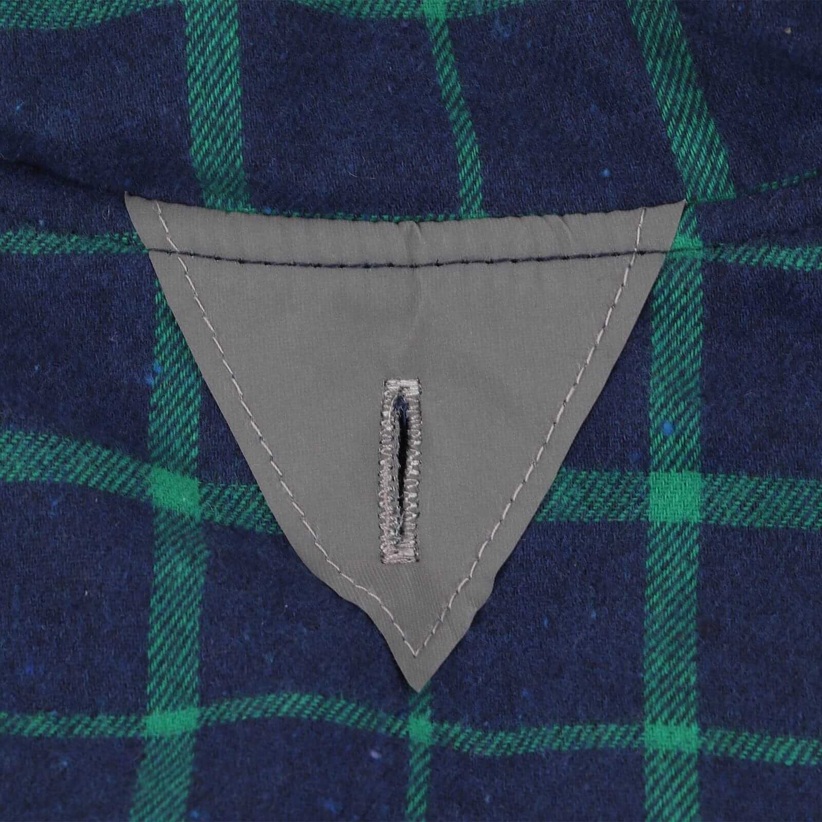 Close-up view of the waistband detail of the Reflective Charge Dog Winter Coat featuring a plaid design and stitching.