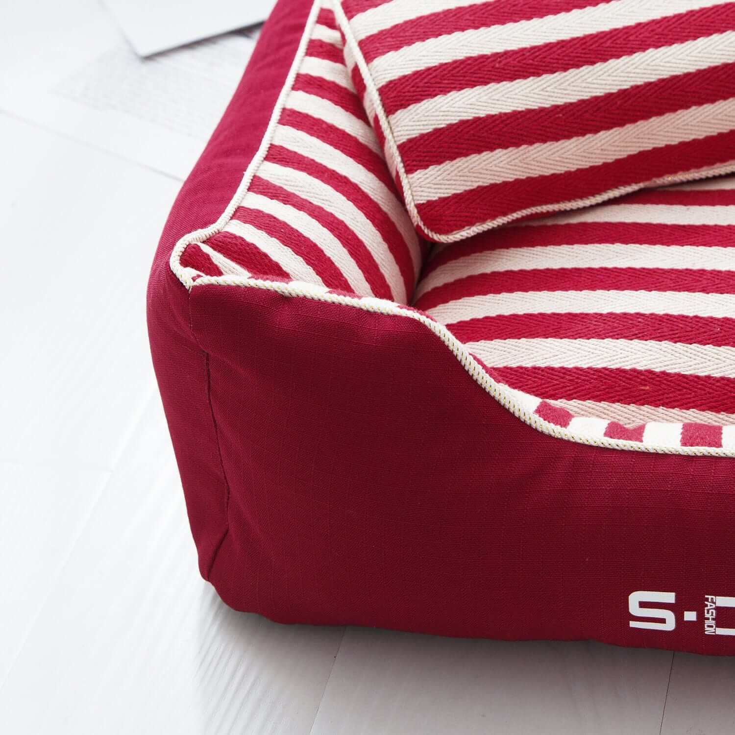 The Royal Haven Pet Bed, luxury pet bed, red and white striped design, cozy resting spot for Dogs & Cats.