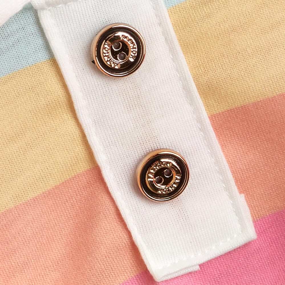 Close-up of buttons on the Sporty Stripe Pet Polo, showcasing trendy design with pastel stripes and stylish detailing.