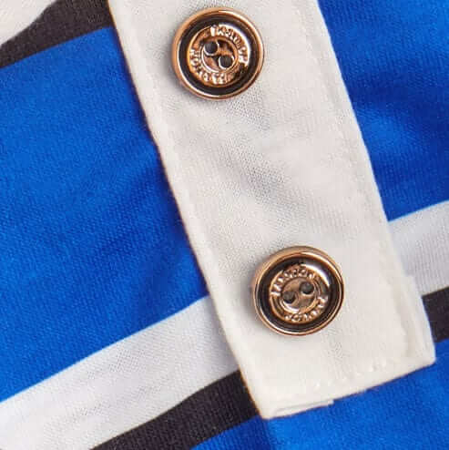 Close-up of buttons on Sporty Stripe Pet Polo shirt featuring breathable fabric and trendy stripe design.