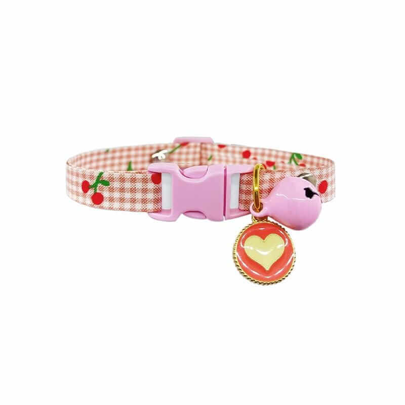 Buckle Closure Cat Bell Collar featuring a pink design, soft materials, and cherry patterns for comfort and safety.