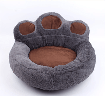 Soft Paw Pet Bed for Dogs & Cats featuring faux fur surface and suede bolsters, perfect for pet napping.